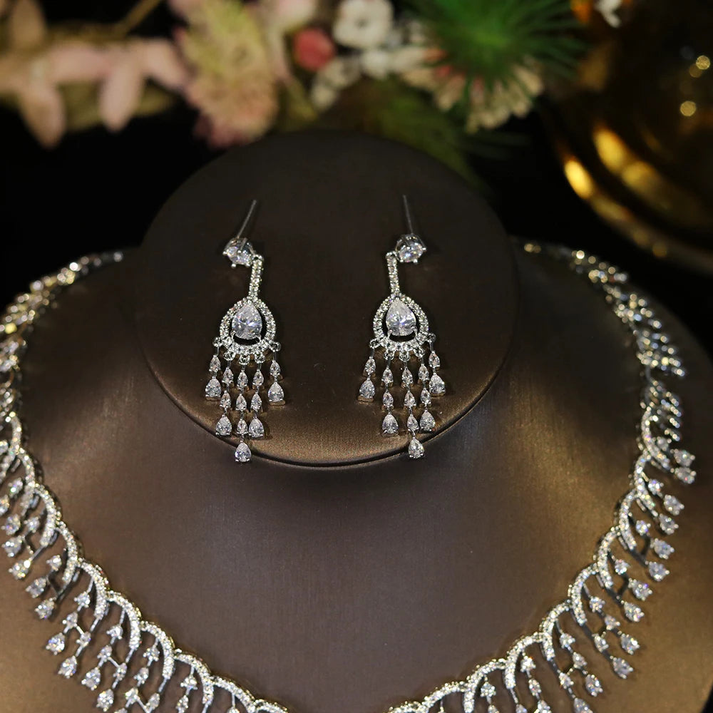 Close-up shot of elegant white CZ tassel dropdown statement earrings from a wedding jewelry collection.