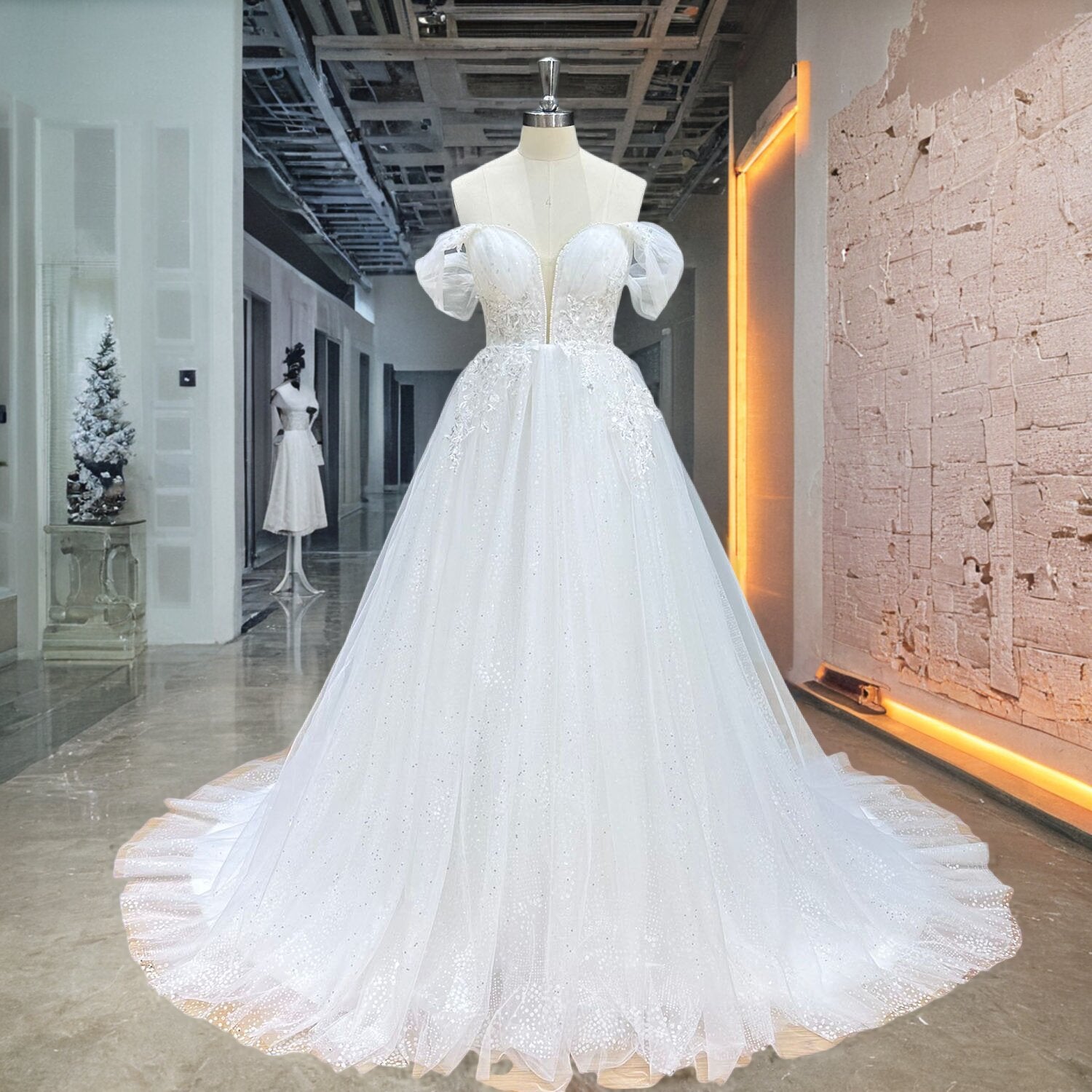 Full-length front shot of a white princess wedding dress on a dress form, showcasing a structured corset bodice with intricate silver beadwork cascading onto a voluminous tulle skirt.