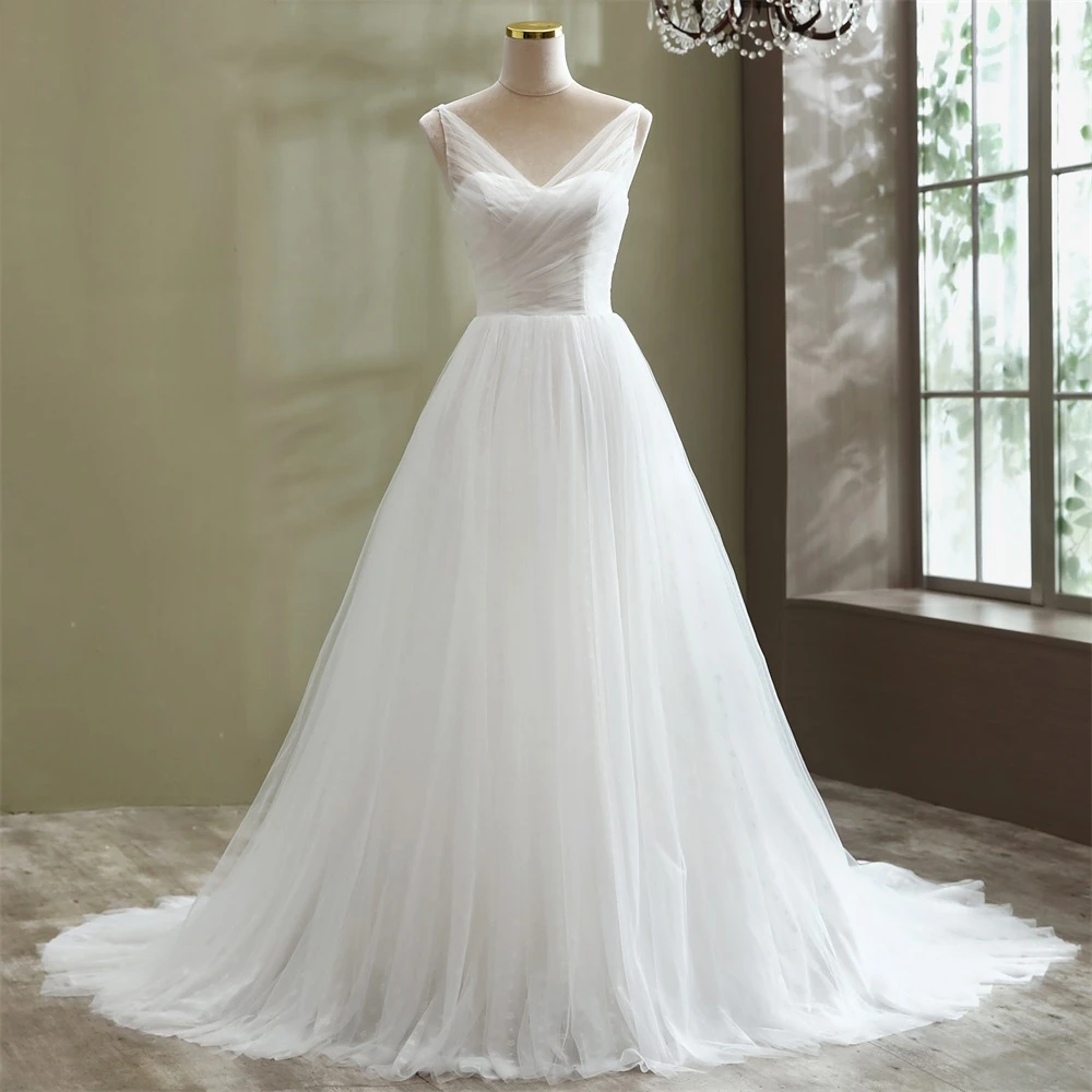 A-line tulle wedding dress displayed on a mannequin, showcasing the sleeveless V-neck bodice and flowing skirt.
