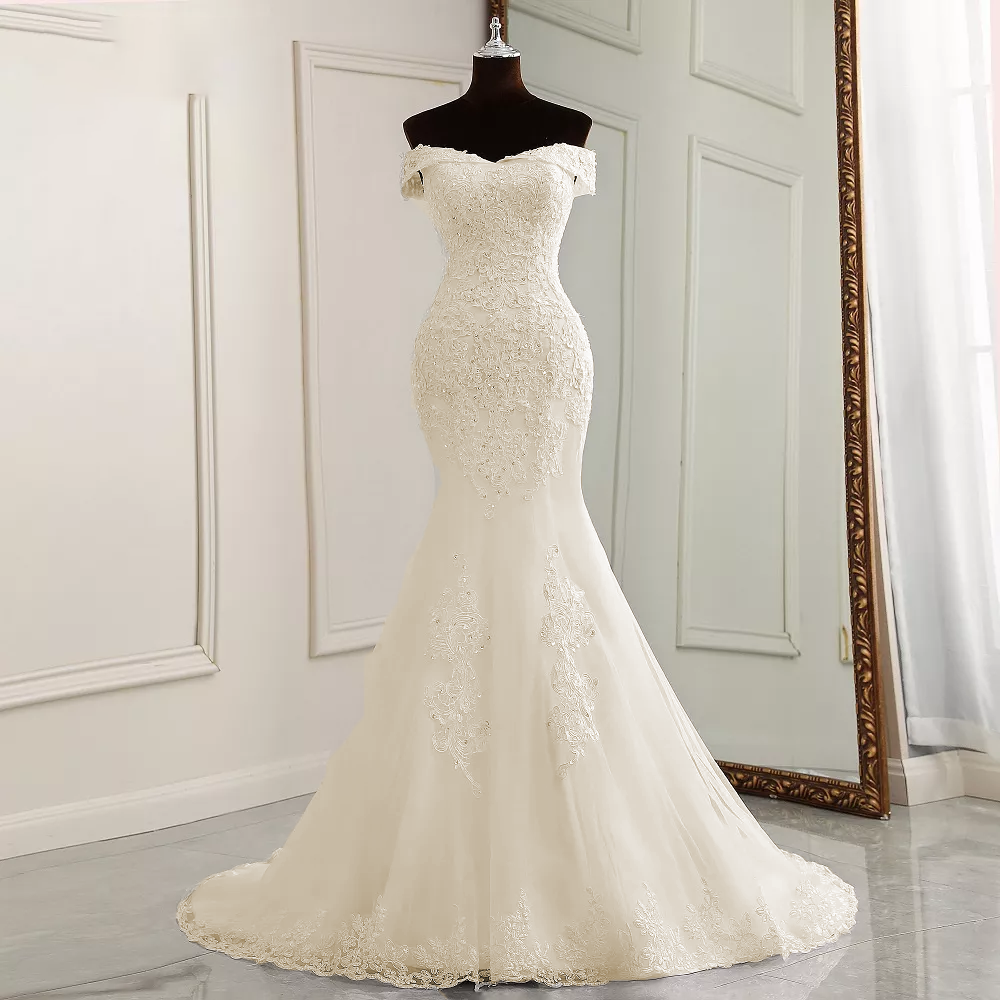 Front view of an elegant, fitted boat neck mermaid wedding dress displayed on a mannequin.