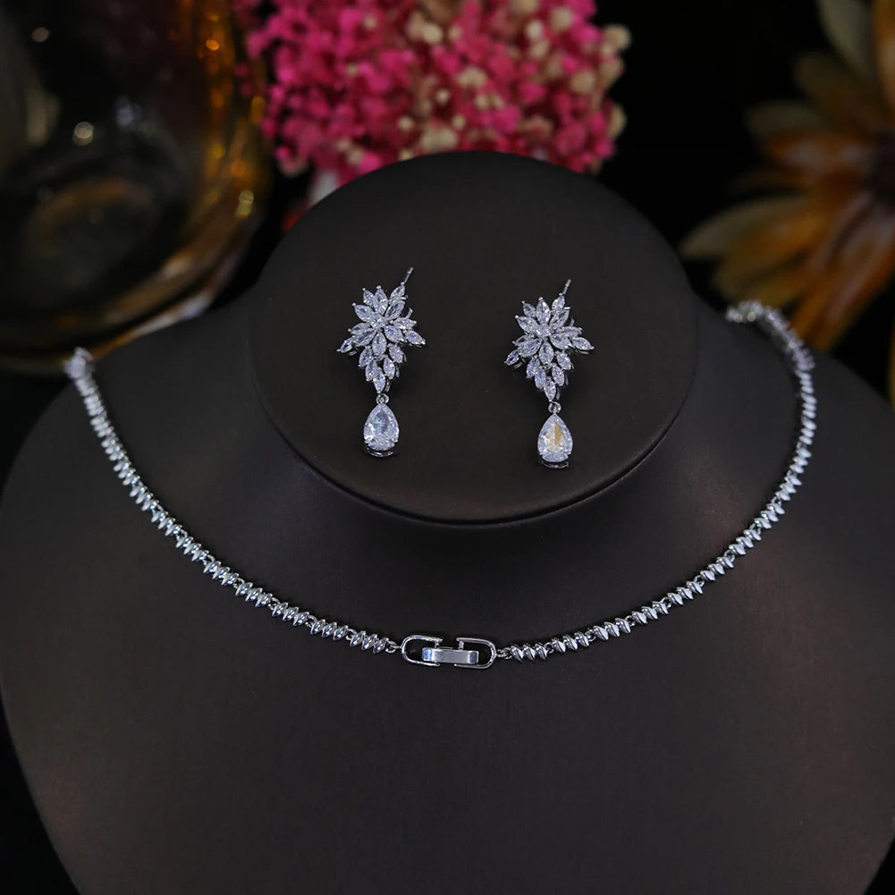 Back view of an elegant CZ bridal necklace clasp and matching floral drop earrings on display