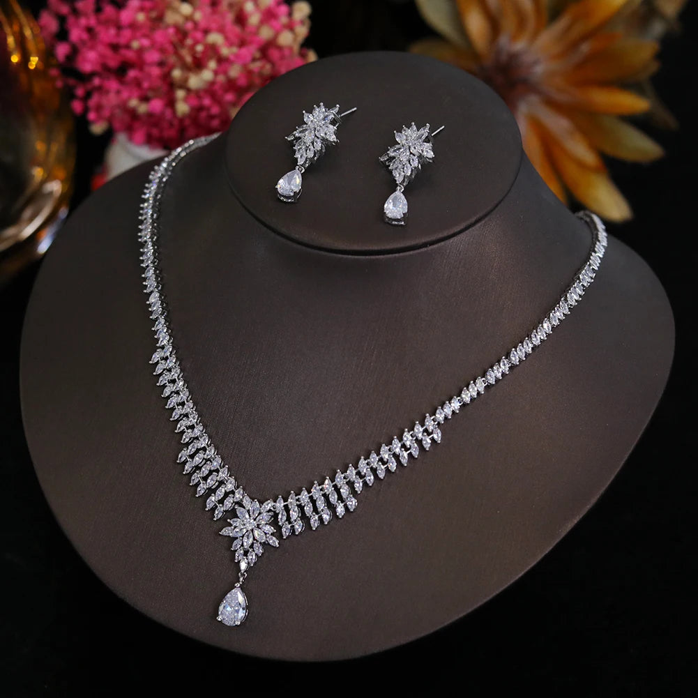 Detailed view of a luxury cubic zirconia bridal necklace and earring set with pear-shaped stone accents