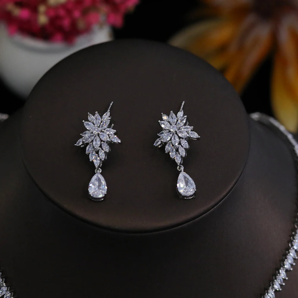 Close-up of intricate floral-design CZ drop earrings from a 2-piece bridal jewelry collection