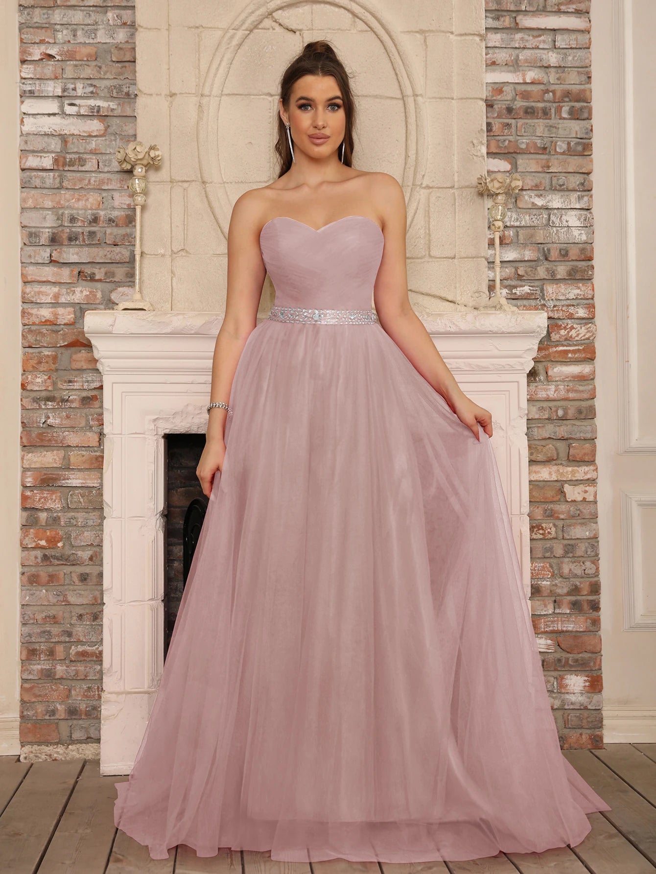 Detailed view of a pink sweetheart neck A-line dress featuring a high-quality crystal-beaded waist belt.