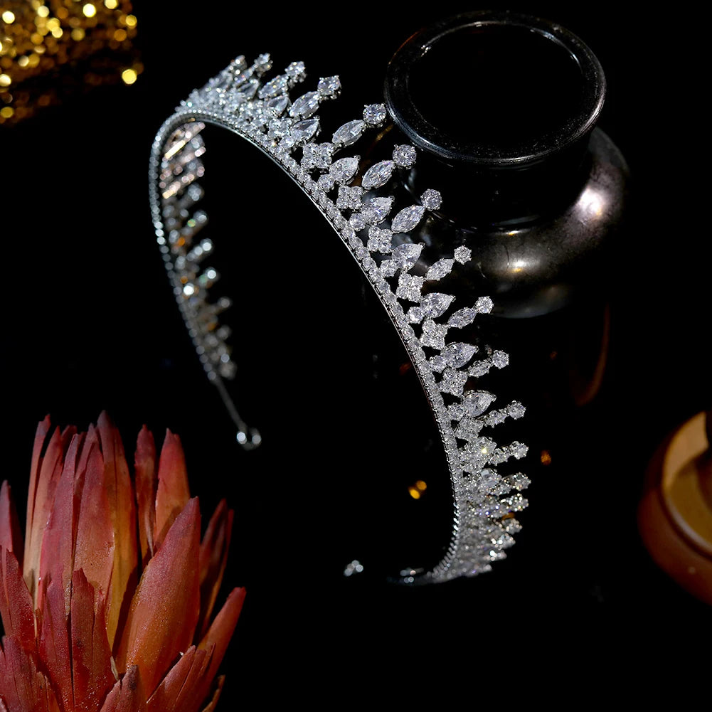 Right-side perspective of a sparkling clear crystal princess tiara showcasing detailed marquise rhinestone cuts.