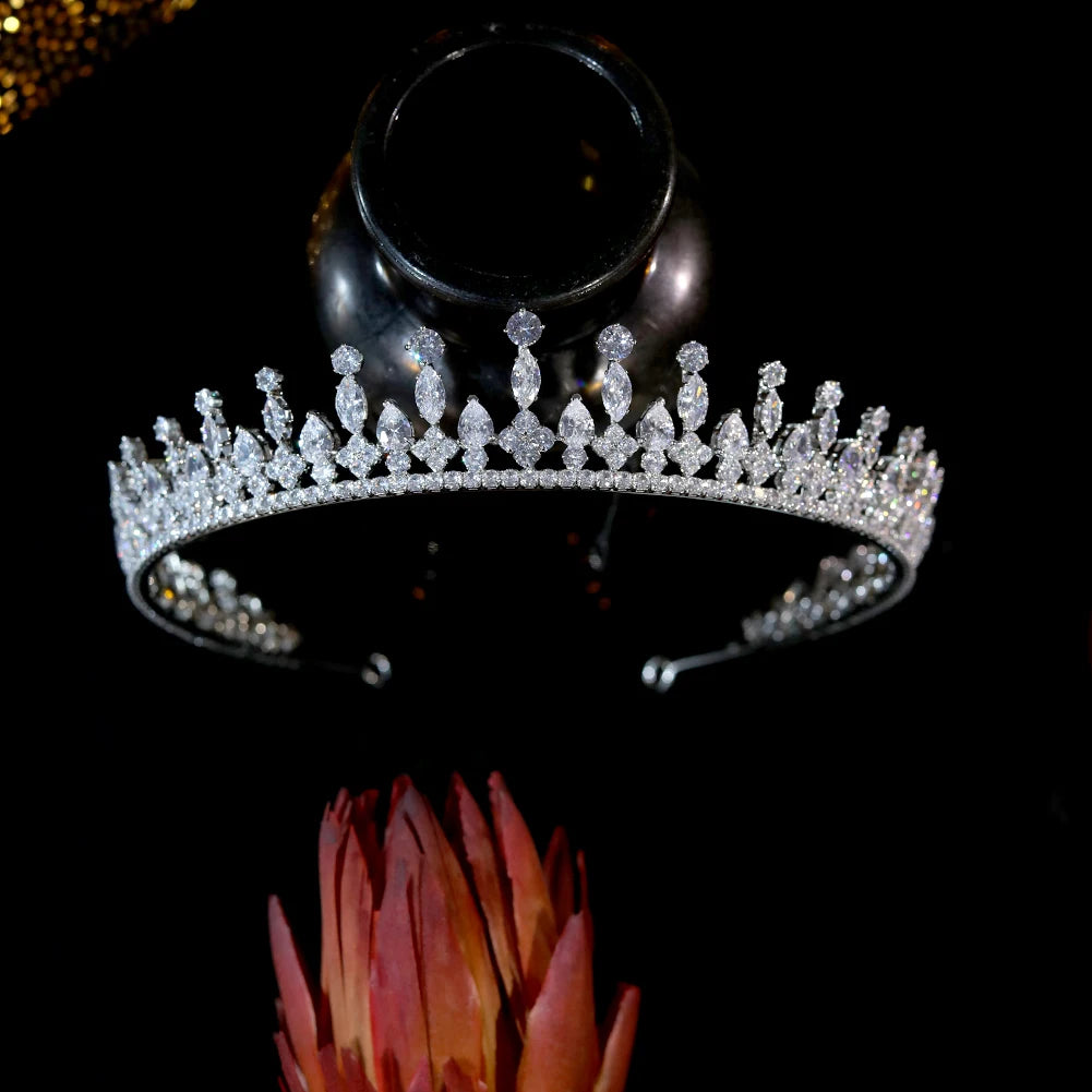 Upside-down display view of a premium silver wedding crown highlighting the flexible inner metal hairband structure.
