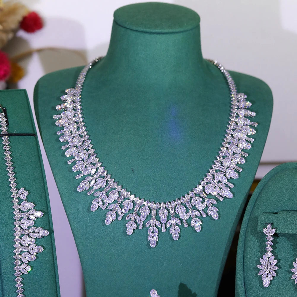 Close-up view of a sparkling cubic zirconia bridal flower collar necklace displayed on a green velvet bust.