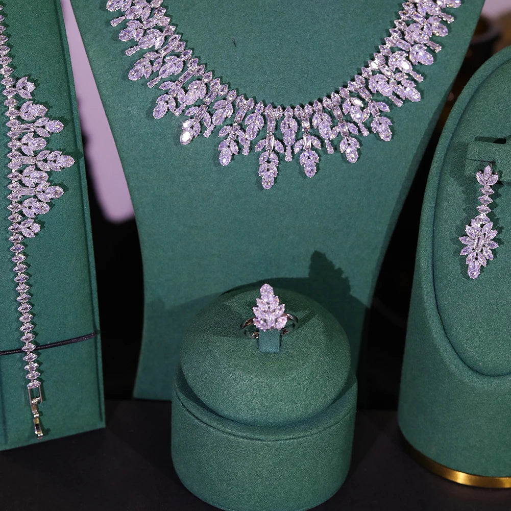 Close-up display highlighting the intricate marquise cluster design of a bridal flower ring and matching jewelry pieces.