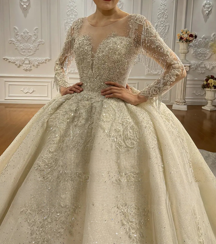 Close-up detail of a luxury wedding dress bodice, highlighting the intricate high-neck lace collar, hand-sewn beading, and delicate floral embroidery on long sleeves.
