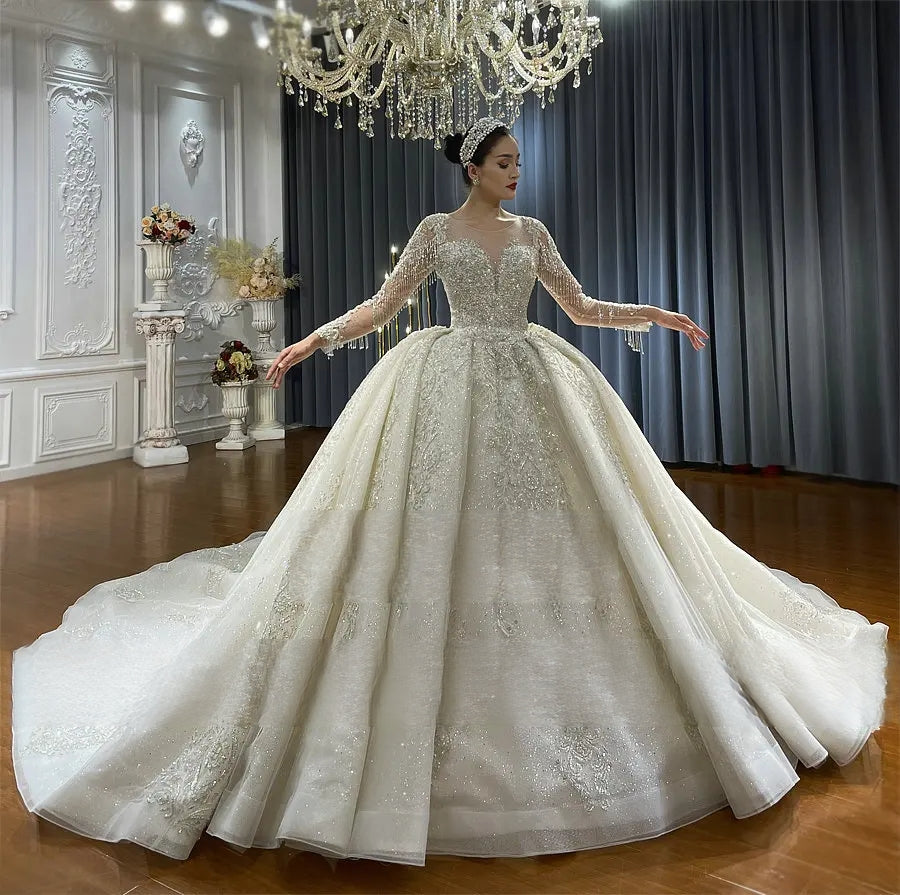 Side profile of a vintage ball gown bridal dress on a Bride, demonstrating the structural volume of the lace-covered skirt and shimmering silver appliqués.