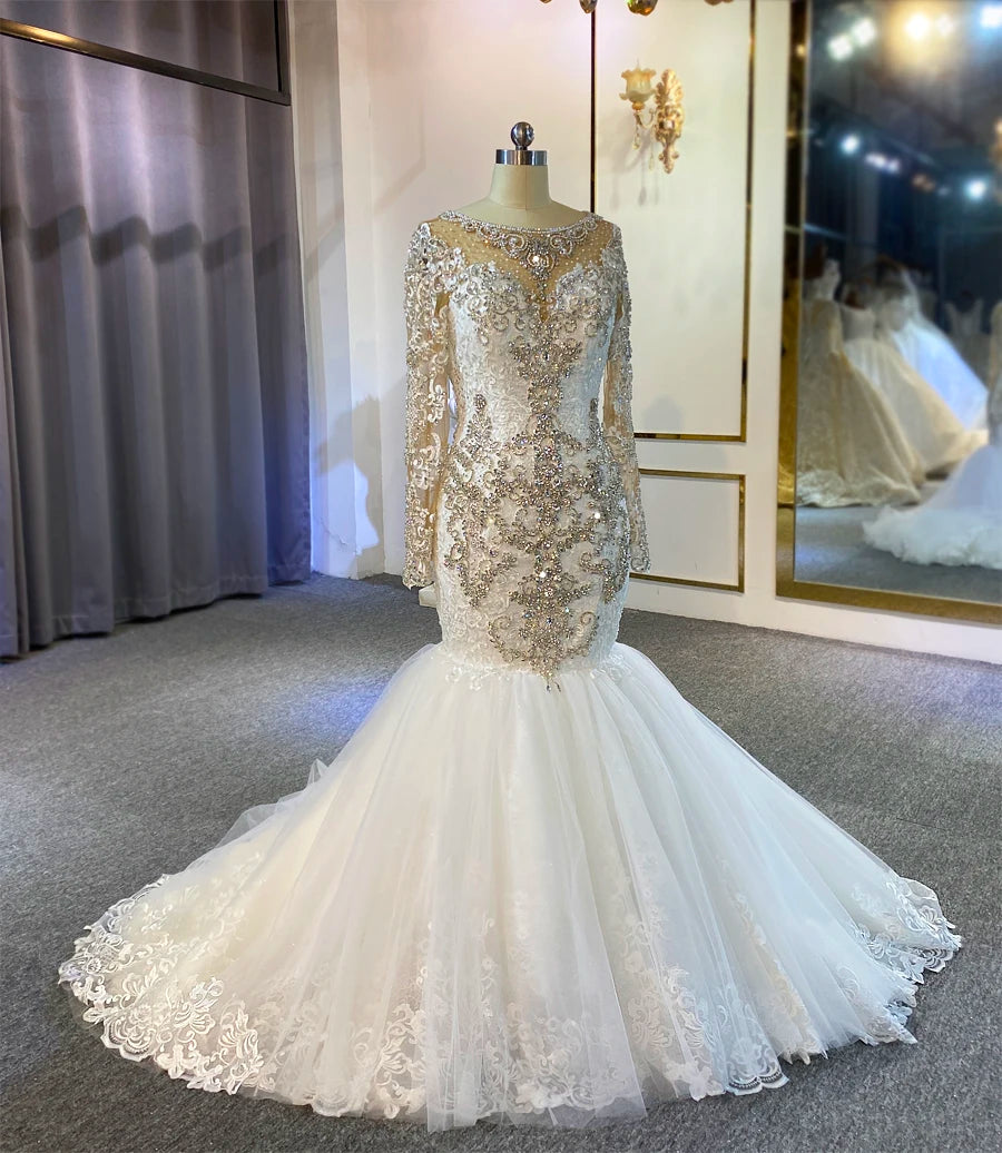 Mermaid-style wedding dress with gold sequin top and white lace skirt on a mannequin.