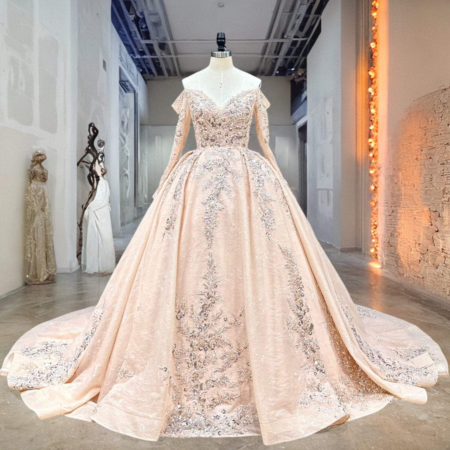 Full front view of a sophisticated long sleeve wedding dress, highlighting the fitted beaded lace bodice and a classic, voluminous ball gown skirt.