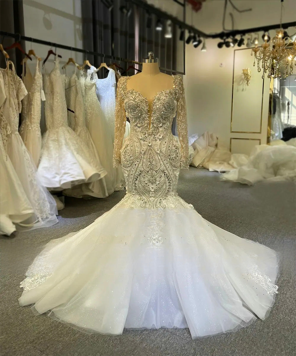 Full-length front view of the beaded lace mermaid wedding dress, showcasing the ornate geometric patterns and the grand flared skirt.