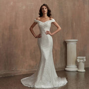 Full-length front view of an elegant lace mermaid wedding dress featuring an off-the-shoulder sweetheart neckline and slim-fit silhouette.
