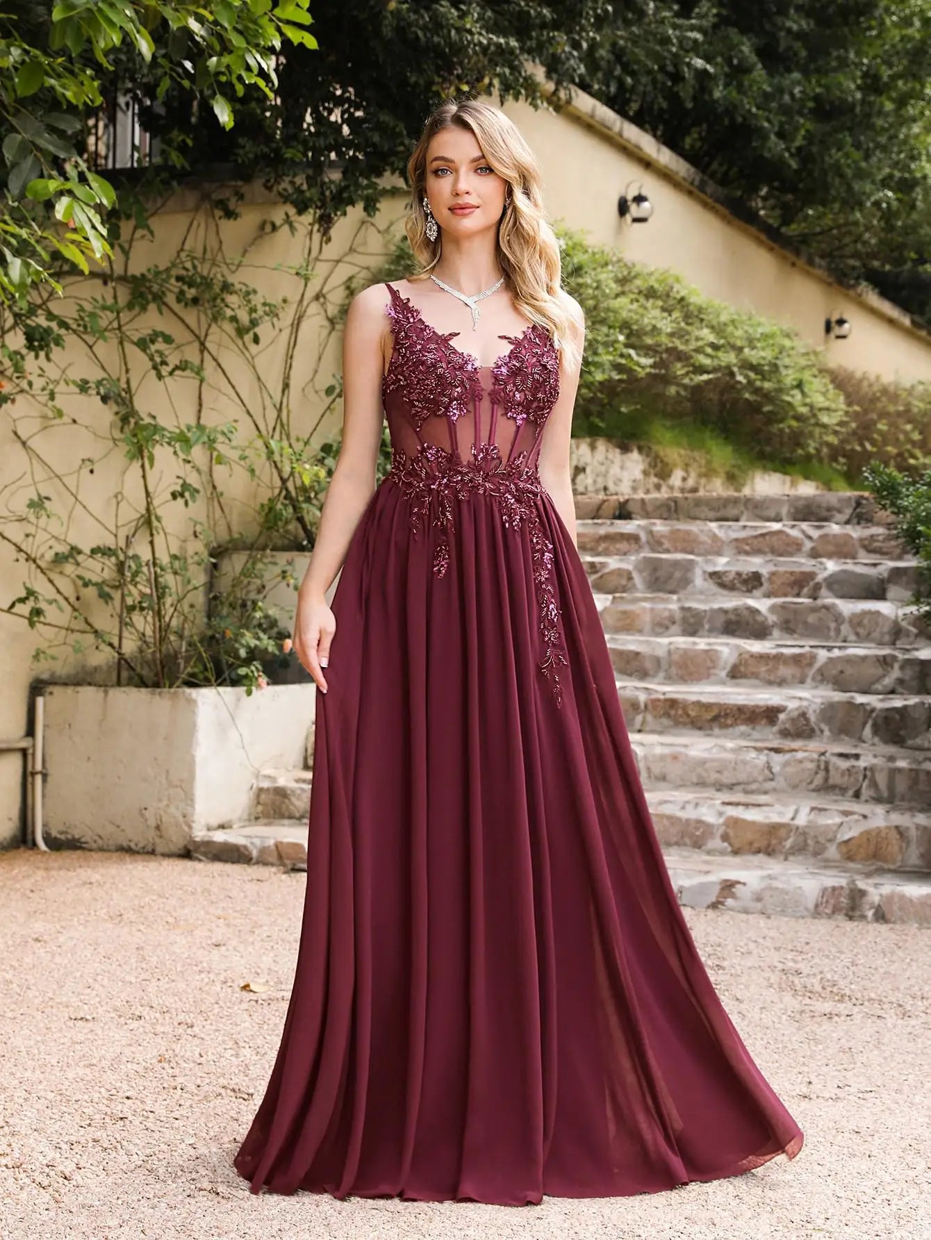 Burgundy A-line evening dress variant with a sheer corset bodice, beaded floral appliques, and a lightweight chiffon skirt for formal occasions.