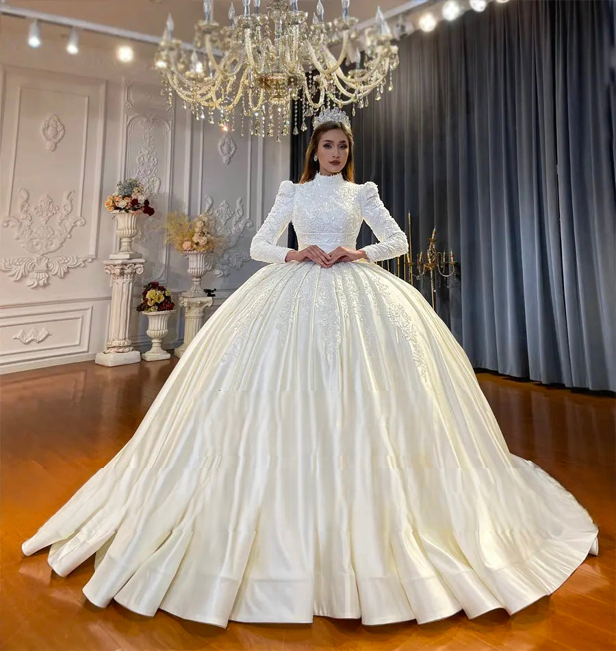 Full front view of a stylish Muslim wedding dress featuring handcrafted lace detailing, modest long sleeves, and a majestic flared skirt for a regal bridal look.