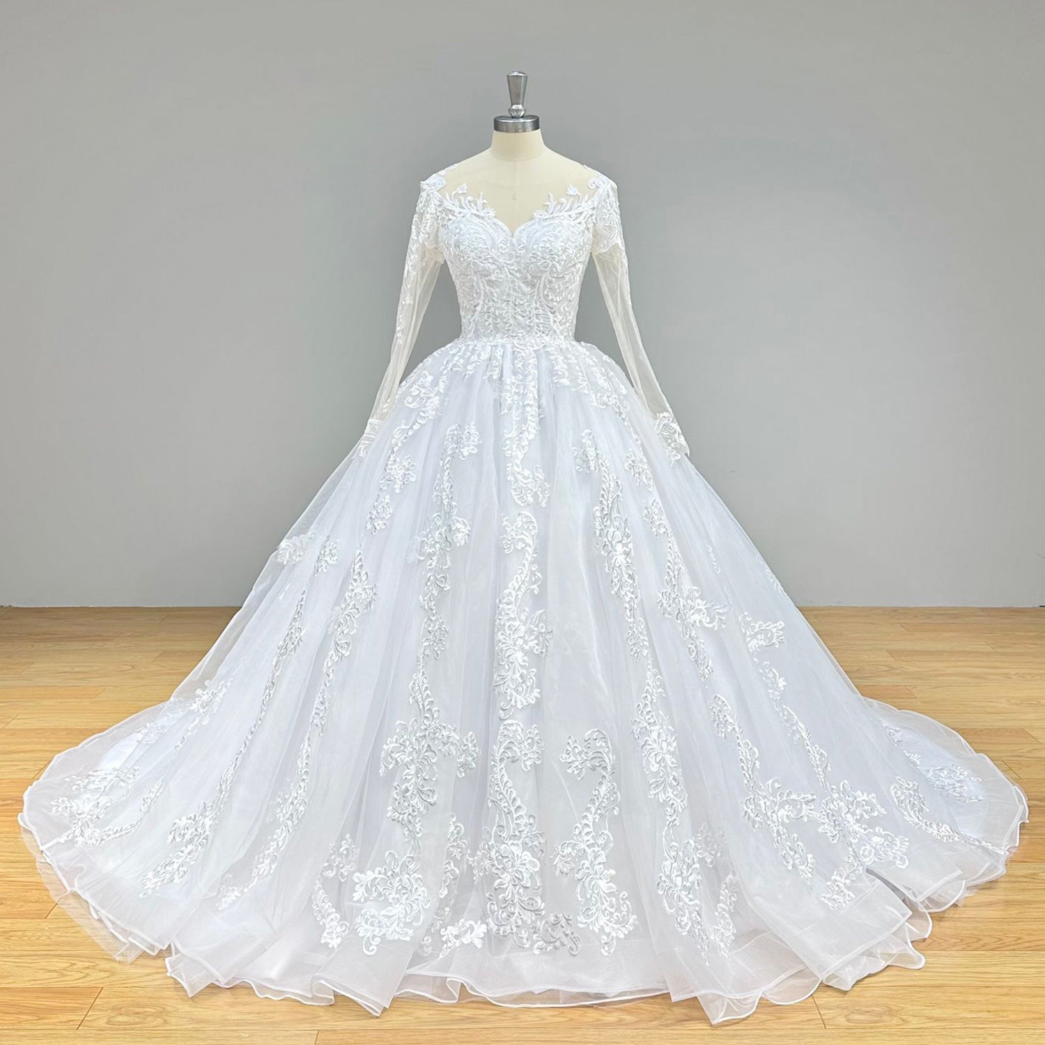 Classic full front studio shot of an O-neck ball gown wedding dress on a mannequin, capturing the timeless bridal silhouette and long sleeve lace design.