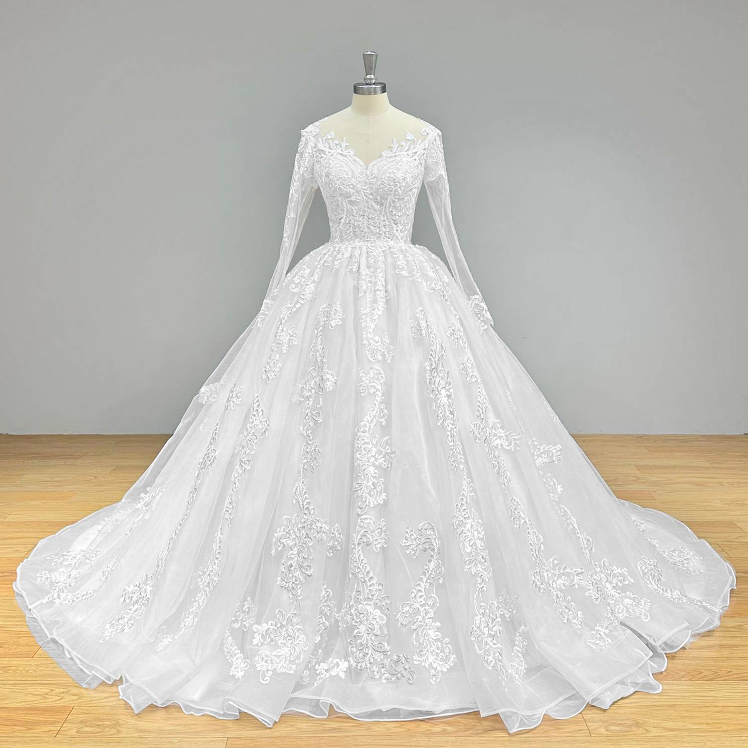 Wide front studio view of a luxury O-neck ball gown wedding dress on a mannequin, perfectly showcasing the grand scale of the skirt and delicate lace long sleeves.