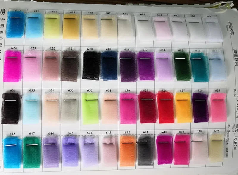 Comprehensive tulle fabric color swatch chart for custom-made short bridal gowns, offering a variety of shades for personalized wedding styling.