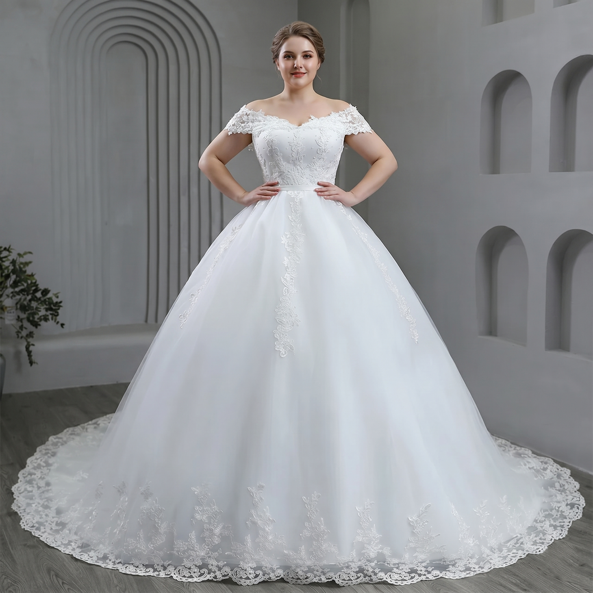Detailed back view of the plus size off-shoulder bridal gown, showcasing an elegant low lace-up corset back design and a sweeping chapel-length tulle train.