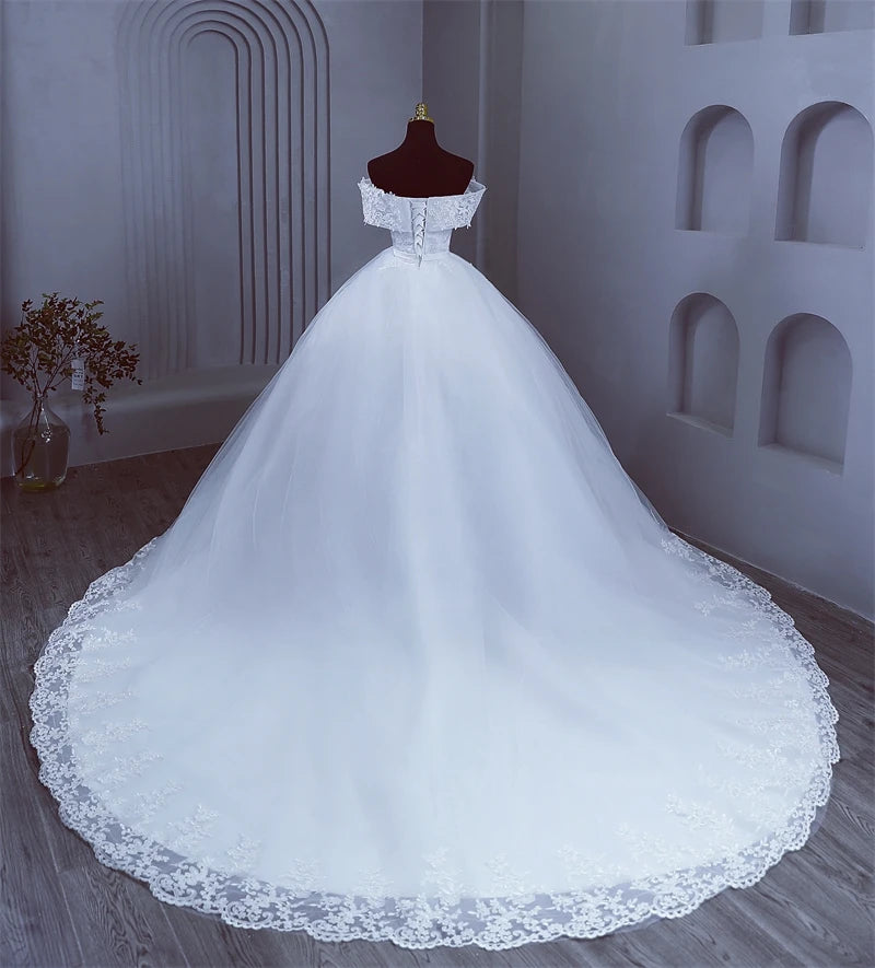 High-resolution full silhouette view of the elegant plus size off-shoulder wedding dress with a corset back, showcasing its timeless royal volume and romantic presentation.