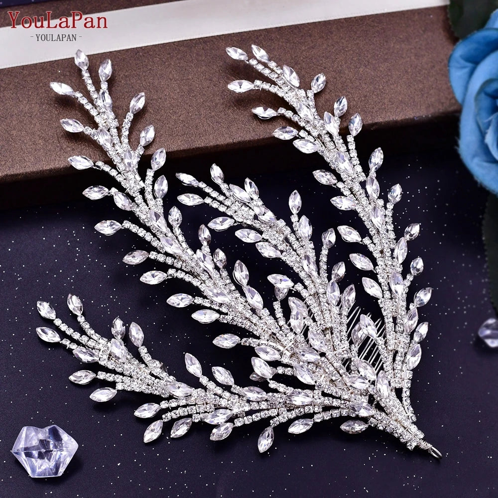 Close-up product view of a flexible multi-branch silver bridal hair comb, showing elongated marquise rhinestones arranged like detailed spray leaves.