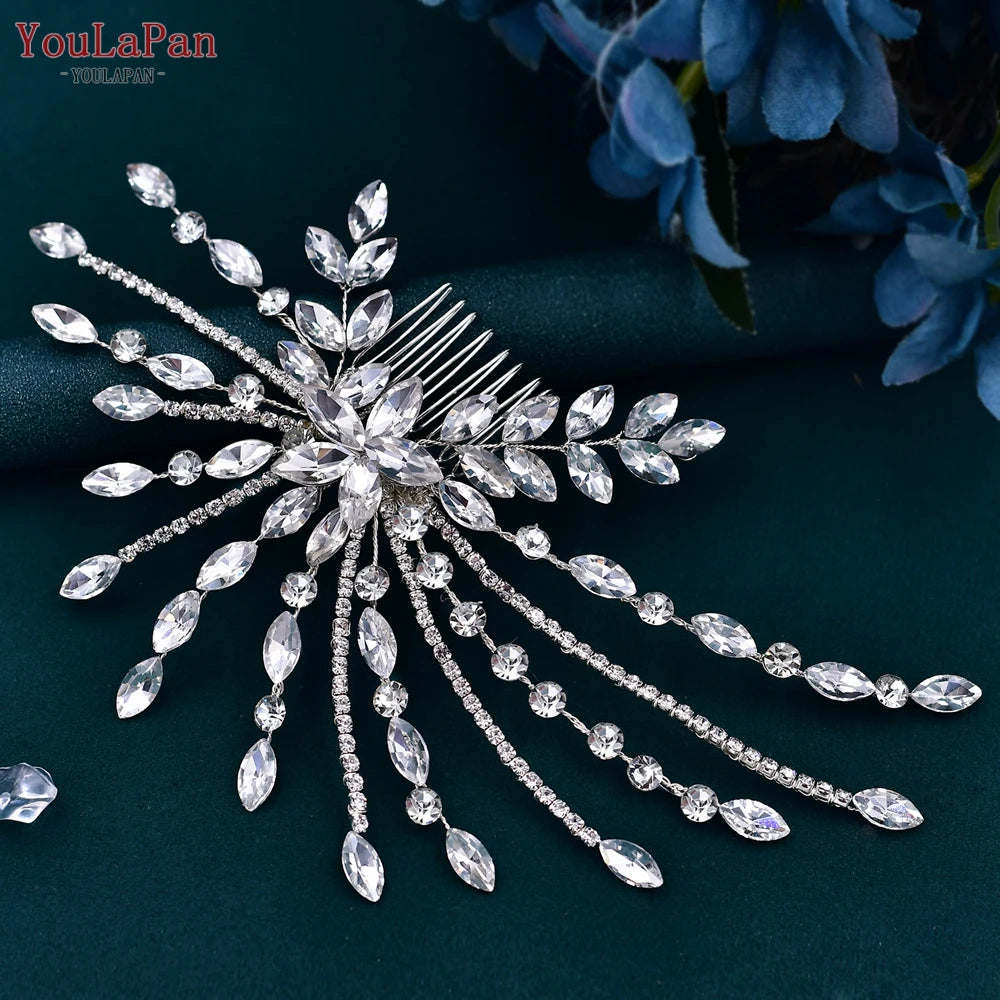Detailed macro photograph focusing on the attached hair comb backing, rhinestone strands, and central crystal blossom cluster of the wedding piece.