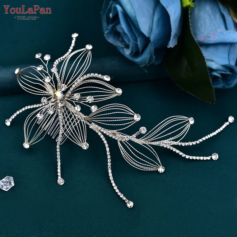 Handcrafted elegant wedding hair clip accessory featuring open-wire silver flower petals and dangling rhinestone tassels over teal silk satin.