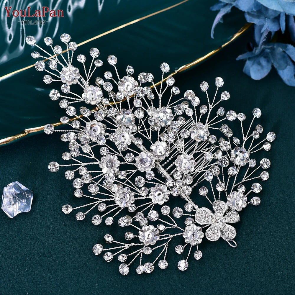 Overhead layout of a large silver crystal bridal hair comb branch, displaying widespread rhinestone sprigs and a central floral motif.