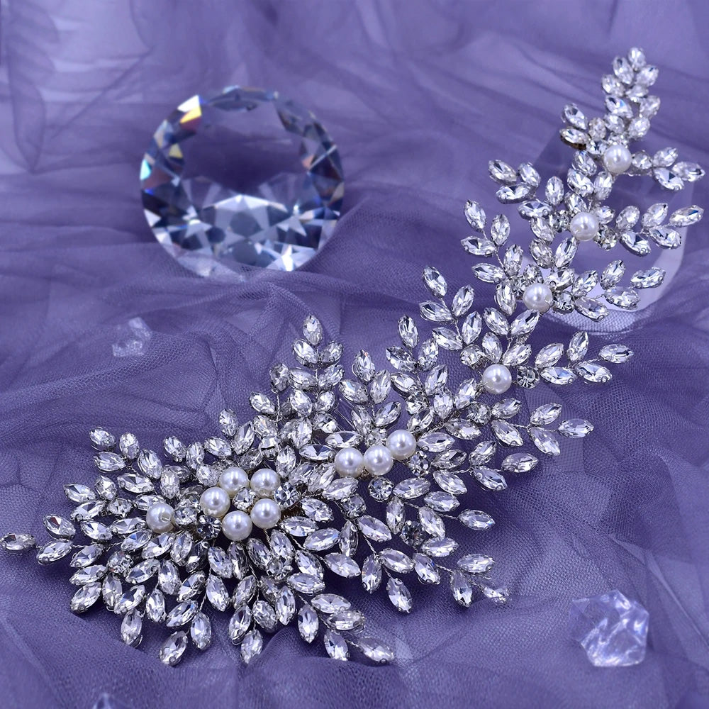 Premium silver crystal bridal hair vine adorned with round white pearls and clear marquise rhinestones, arranged over a soft purple tulle fabric.