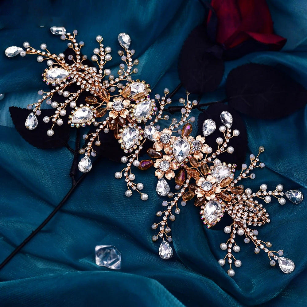 Close-up perspective of a rose gold wedding hair accessory with hand-wired vine branches, clear marquise crystals, and small ivory pearl clusters.