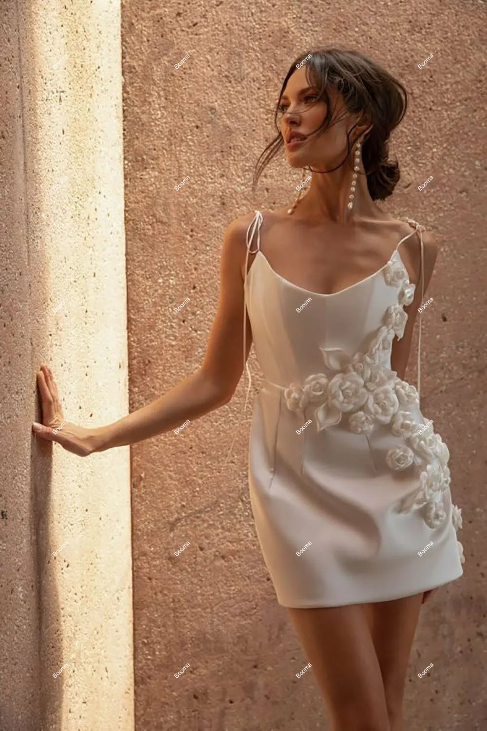 Charming short A-line bridal gown with a sweetheart neckline, adjustable spaghetti straps, and detailed 3D floral embroidery for a bohemian wedding look.