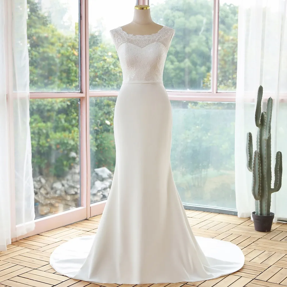 Front view of a mannequin displaying a simple lace sleeveless mermaid wedding dress, perfect for a refined bridal look.