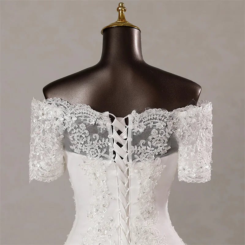  Detailed back view of the sweetheart mermaid bridal gown, focusing on the intricate lace detailing and the adjustable corset closure