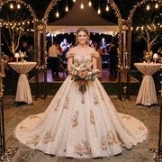 Elegant tulle A-line wedding dress with handmade floral accents and intricate lace details, designed for a luxury bridal look.