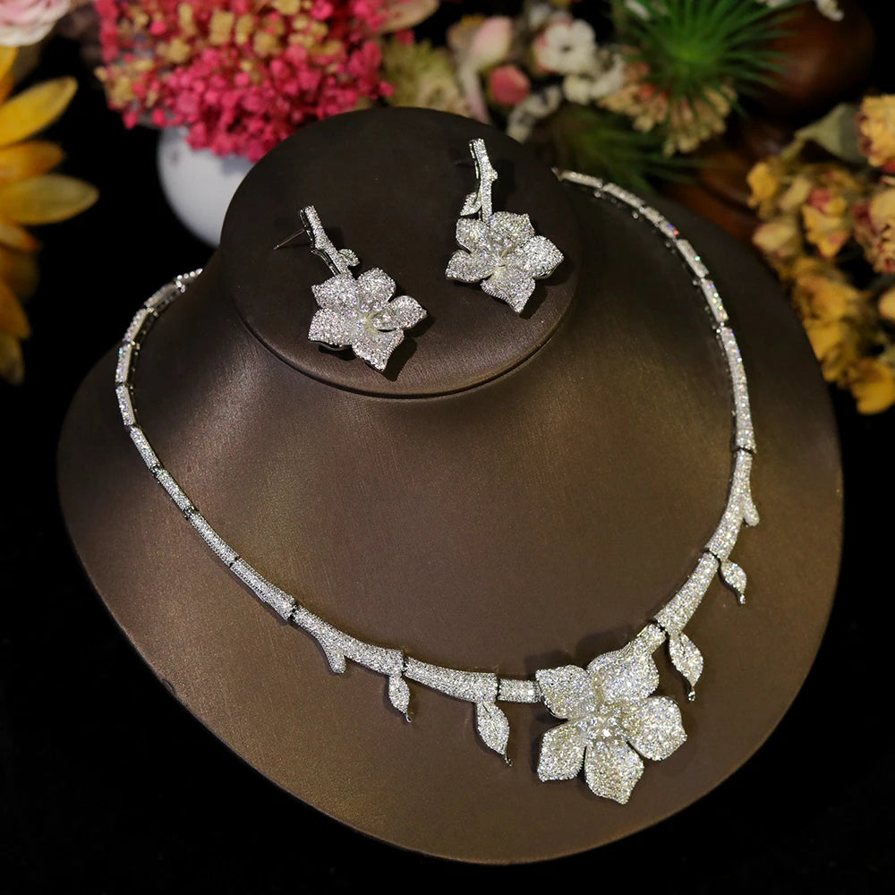 Detailed view of the crystal flower motif on a white CZ bridal necklace and earring set