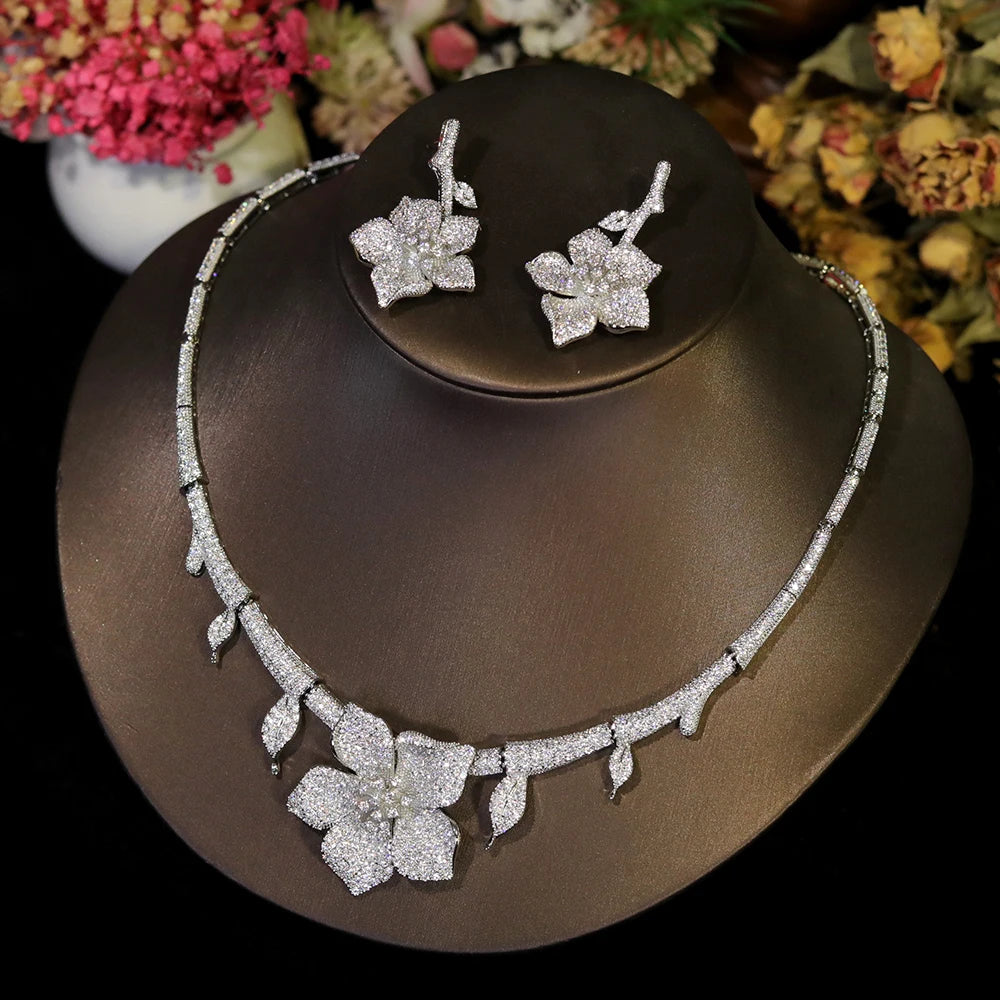 Side view of elegant white flower CZ wedding necklace and matching bridal jewelry accessories