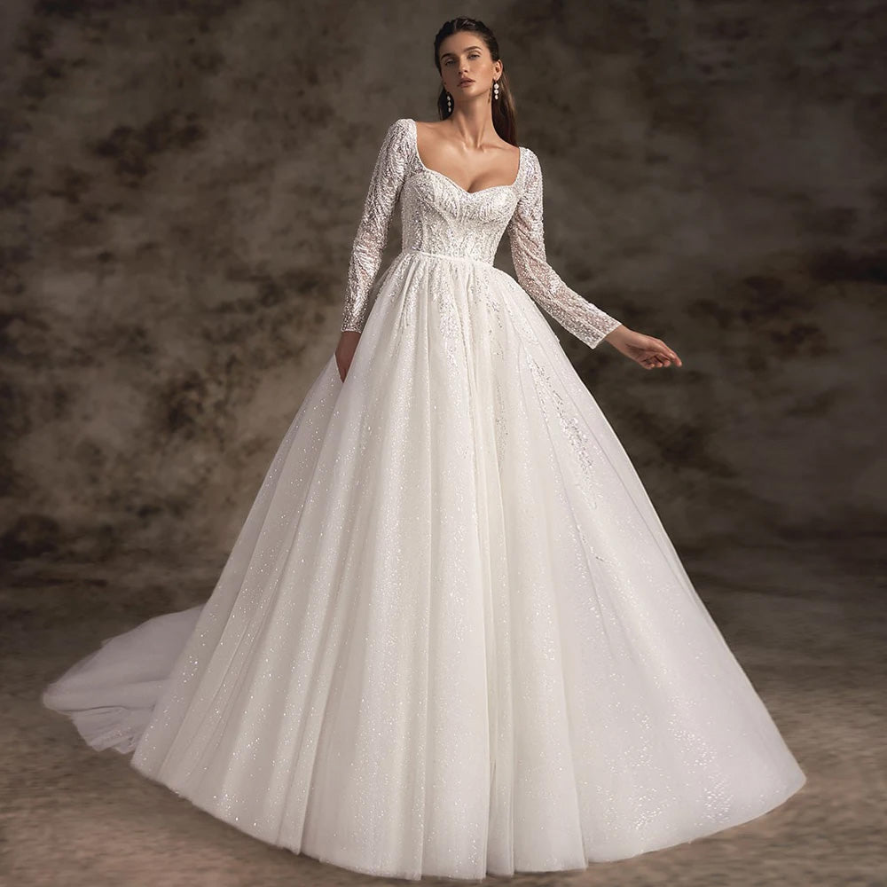 Side profile of a bride in a V-neck lace A-line bridal gown, showcasing the elegant appliques, flowers, and the full skirt of the dress.