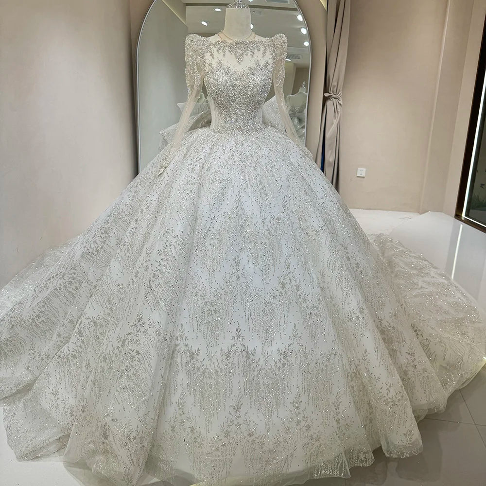 Full front display of an exquisite princess ball gown wedding dress on a mannequin, highlighting the all-over silver glitter embroidery and high-neck illusion bodice.