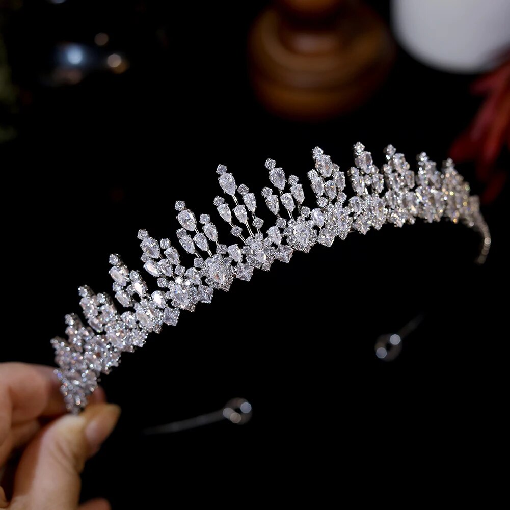 Alternate close-up look of the handmade marquise crystal wedding tiara held in hand, emphasizing the brilliant clarity of the multi-tiered rhinestone framework.