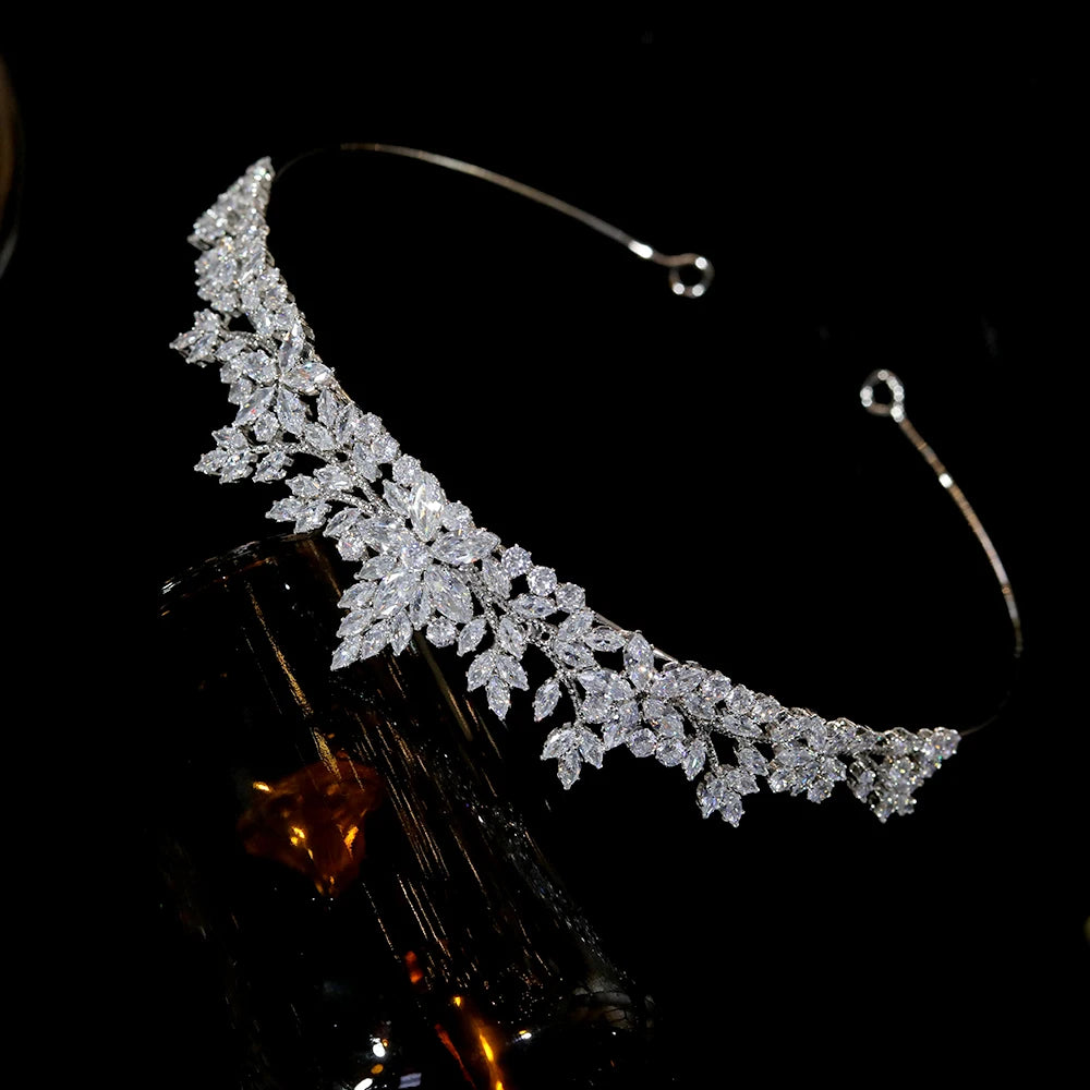 High-angle shot showing the lightweight metal wire framework and loop ends of a silver cubic zirconia bridesmaid tiara band.
