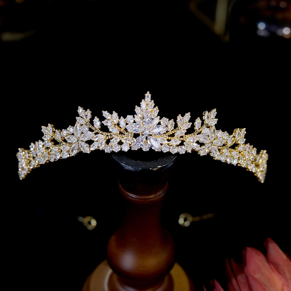 Front view of a luxury yellow gold crystal tiara crown hair accessory for girls, proms, or wedding parties.