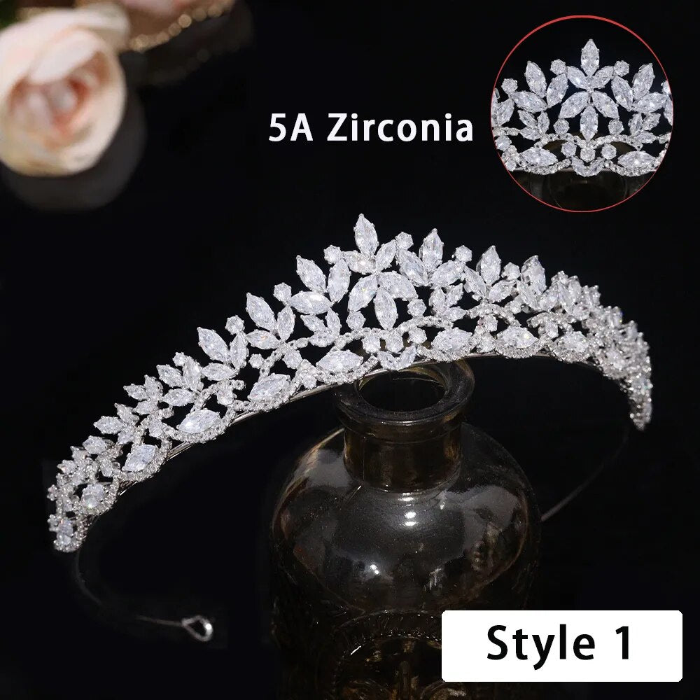 Side-profile perspective product shot of a premium silver floral CZ wedding crown tiara emphasizing its brilliant 5A level cubic zirconia marquise cut clusters.