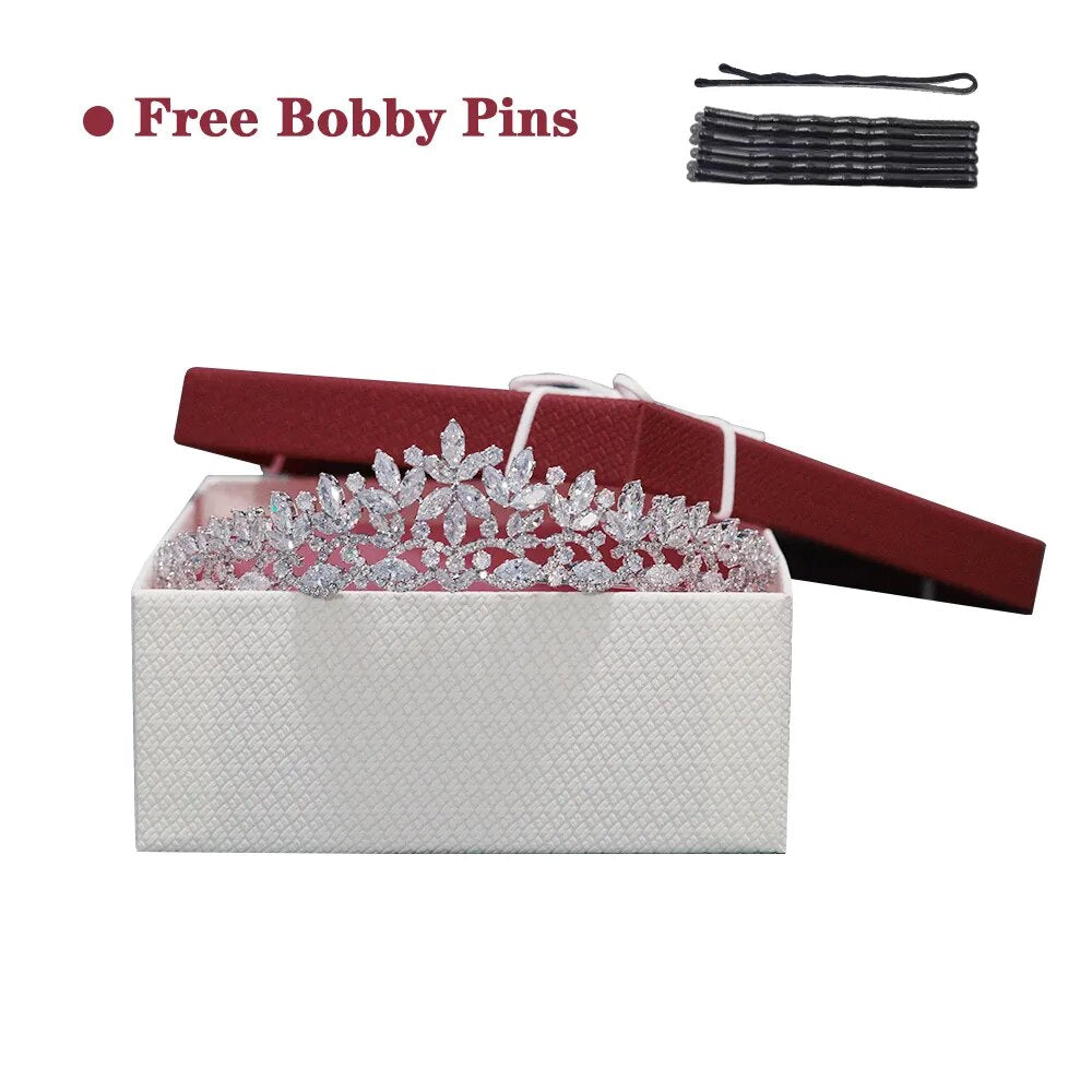 Premium silver floral CZ bridal tiara nestled inside an open white texturized presentation box with a red lid, displayed alongside a free set of black bobby pins.
