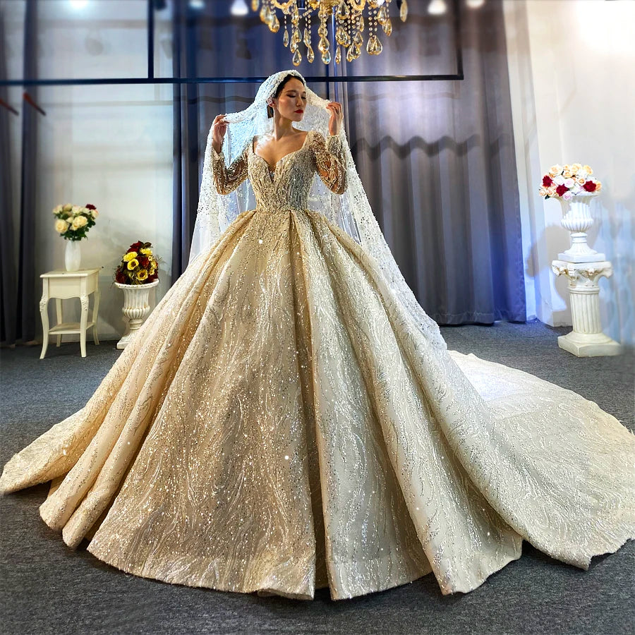 Full front view of a high-quality bridal gown featuring a high neck and long sleeves, completely covered in intricate silver beading with a grand ball gown silhouette.