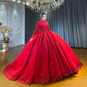 Full front view of a model showcasing a stunning full coverage wine red Muslim wedding dress featuring a high neckline, long sleeves, and a voluminous ball gown skirt with heavy hand beading.