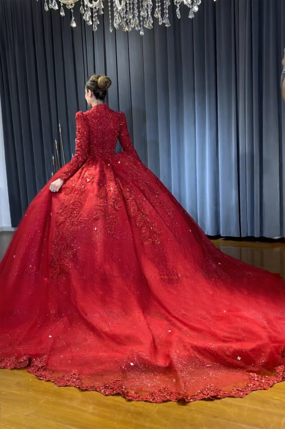 Full rear view of the wine red Muslim wedding dress, displaying the elegant high-neck design, long sleeves, and a sweeping, heavily embellished cathedral-length train.