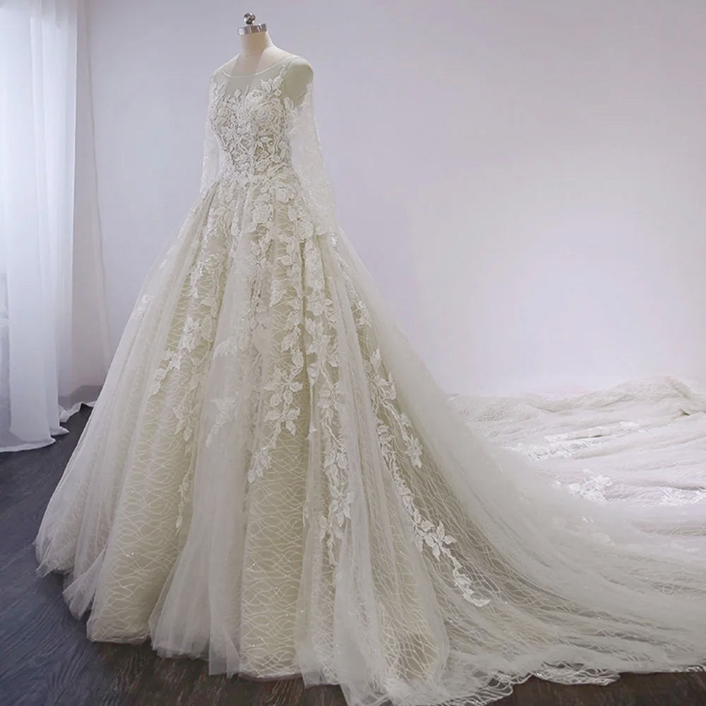 Front profile of a full-sleeve A-line wedding dress featuring intricate lace and beading, displayed on a mannequin.