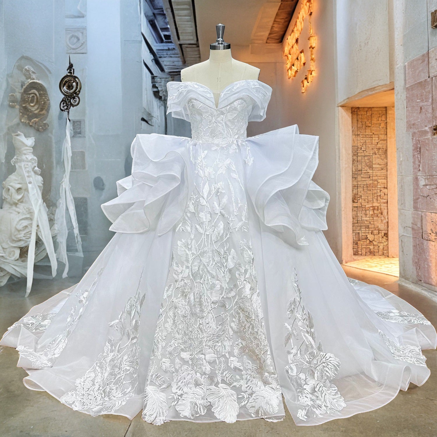 Front view of the luxury sweetheart neckline bridal gown with structural organza pick-up ruffles displayed on a mannequin in a bridal showroom hallway.