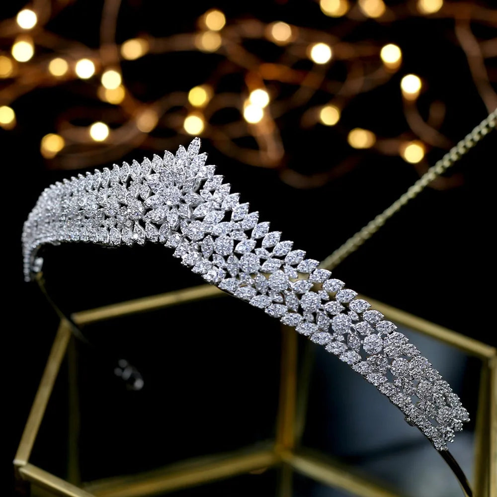 Alternative side perspective of the gorgeous crystal princess tiara crown, showcasing the tapered band layout against a dark background.